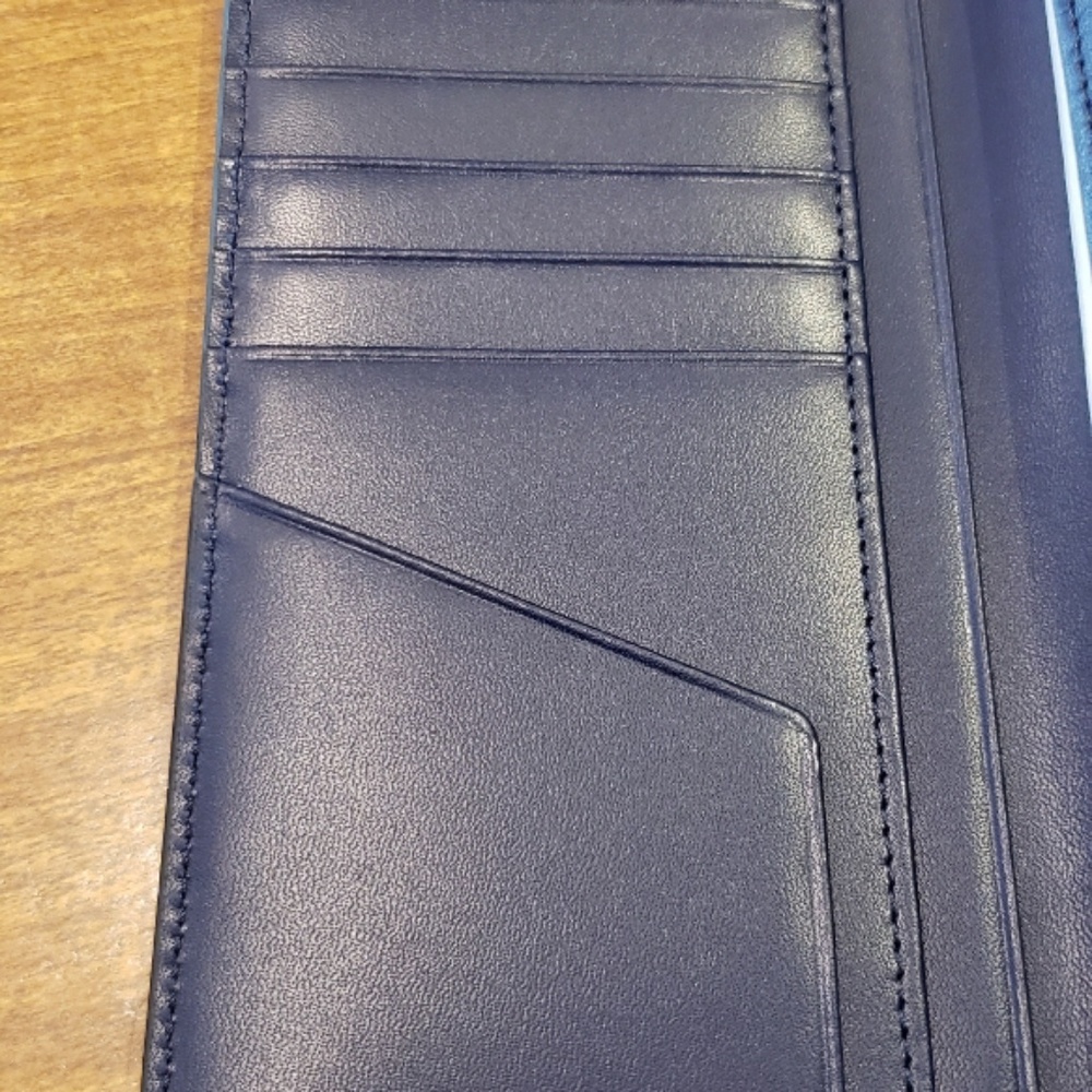 Black MCM bi-fold tall wallet
